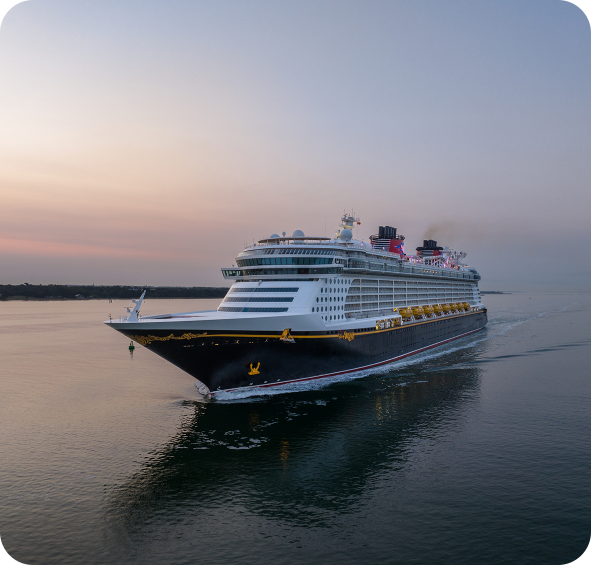 Cruise ship sailing at sunset on water.