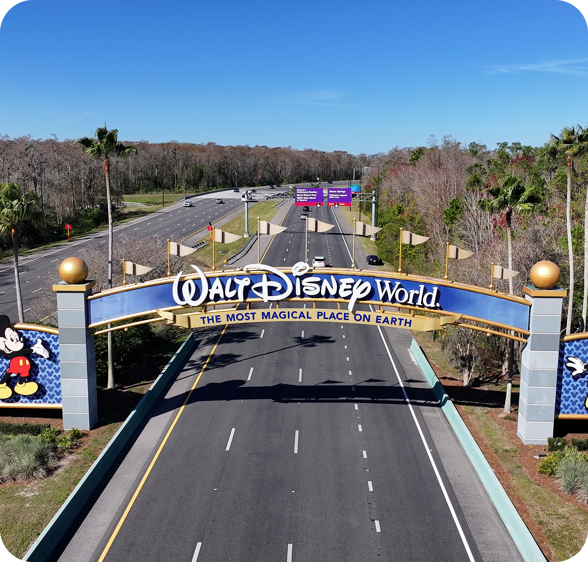 Walt Disney World entrance archway with road.
